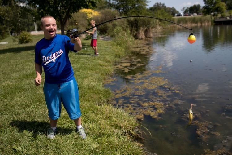 At pond near Elkhorn, kids with special needs hone their fishing skills