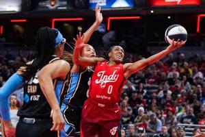 Indiana Fever guard Kelsey Mitchell (0) shoots the ball against Atlanta Dream forward Naz Hillmon (00) during the first half at Gainbridge Fieldhouse on Jun 4, 2026 in Indianapolis, Indiana.