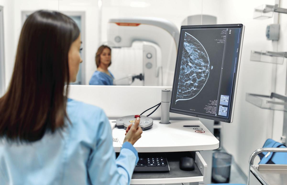 In the hospital, the patient undergoes a screening procedure for a mammogram, which is performed by a mammogram. A modern technologically advanced clinic with professional doctors.