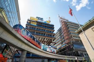 The People Mover cruises by as construction continues at the Hudson's site on Tuesday, Aug. 30, 2022.