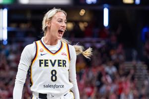 Aug 11, 2026; Indianapolis, Indiana, USA;  Indiana Fever guard Sophie Cunningham (8) celebrates a made shot in the second half against the New York Liberty at Gainbridge Fieldhouse. Mandatory Credit: Trevor Ruszkowski-Imagn Images