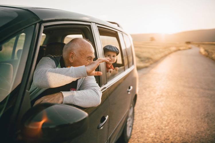 Grandfather and grandson having fun on the roadtrip