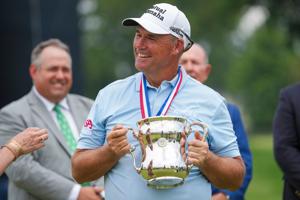 Padraig Harrington holds the Francis D. Ouimet Memorial Trophy after winning the 2026 U.S. Senior Open at Scioto Country Club.