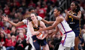 Phoenix Mercury forward Alyssa Thomas (25) attempts to strip the ball from Indiana Fever guard Caitlin Clark (22) on Monday,
