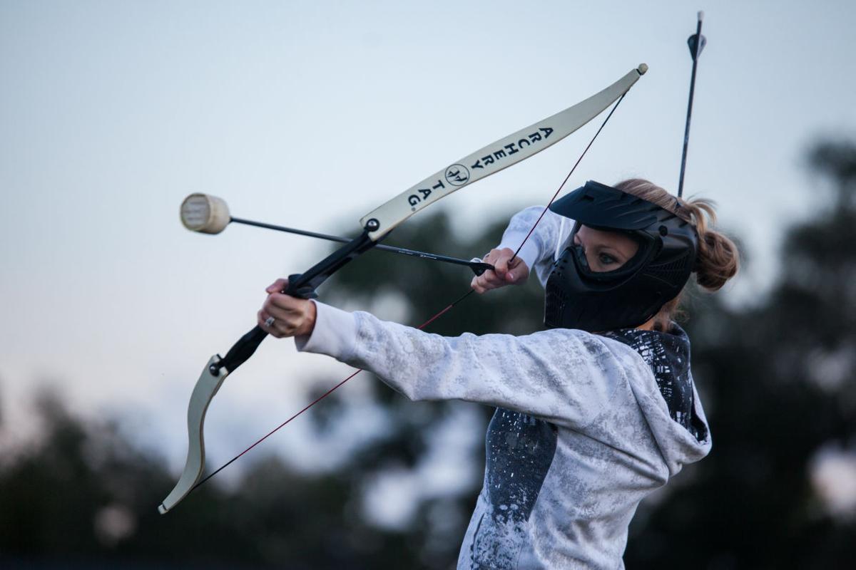 They play dodgeball but, like, with bows and arrows Living
