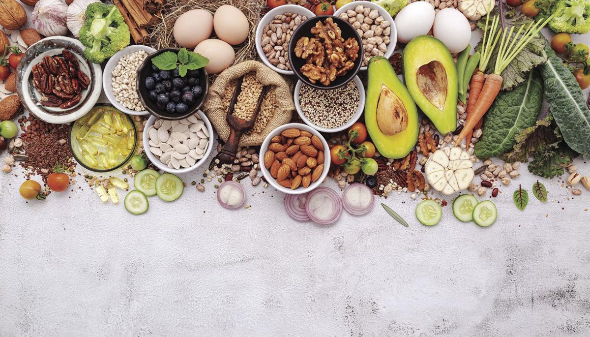 Ingredients for the healthy foods selection. The concept of superfoods set up on white shabby concrete background with copy space.