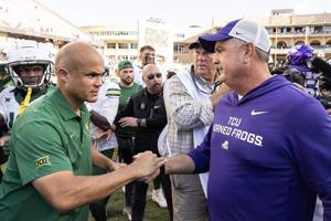 Baylor head coach Dave Aranda, left, and Texas Christian head coach Sonny Dykes, right, greet each other TCU's 42-36 win at Amon G Carter Stadium on Saturday, Oct. 18, 2025, in Fort Worth, Texas.