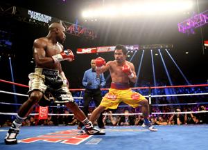 Manny Pacquiao (right) against Floyd Mayweather during their May 2, 2015 boxing bout at the MGM Grand Garden Arena.