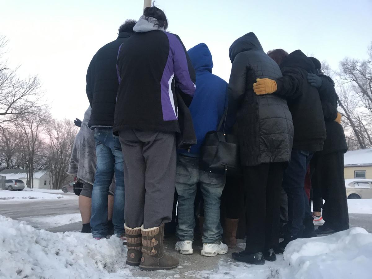 Friends and family gather in sub-zero wind chills to mourn slain man