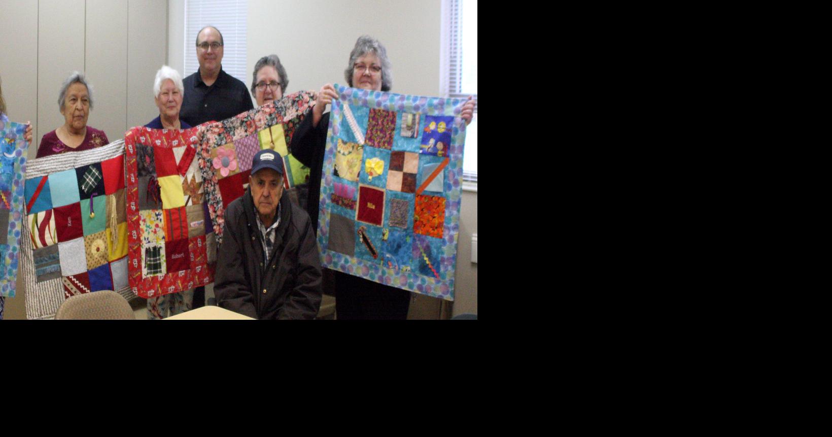 La Vista club donating quilts