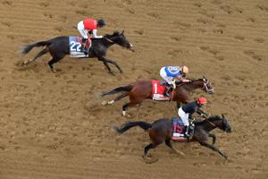 Golden Tempo, with Jose L. Ortiz up, crosses the finish line ahead of Renegade, with Irad Ortiz Jr. up, to win the 152nd running