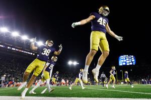 Notre Dame linebacker Jerry Rullo (46) hypes up the crowd after a kickoff in the second half of a NCAA football game against Syracuse at Notre Dame Stadium on Saturday, Nov. 22, 2025, in South Bend.