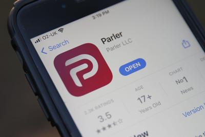 The Parler logo on a smartphone.