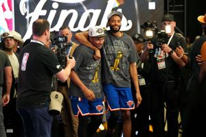Jun 13, 2026; San Antonio, Texas, USA; New York Knicks guard Miles McBride (left) and guard Mikal Bridges (right) walk off the court after the Knicks defeat the San Antonio Spurs during game five of the 2026 NBA Finals at Frost Bank Center. Mandatory