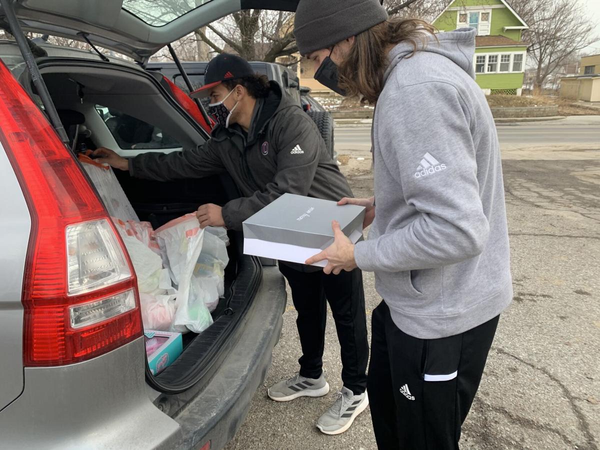 UNO athletes deliver gifts to connect with North Omaha families