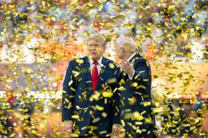 President Donald Trump and FIFA President Gianni Infantino talk while confetti falls from the air as part of the World Cup