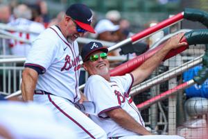 Sep 28, 2025; Cumberland, Georgia, USA; Atlanta Braves bench coach/infield coach Walt Weiss (4) and manager Brian Snitker (43) laugh in the dugout during the game against the Pittsburgh Pirates during the third inning at Truist Park. Mandatory Credit