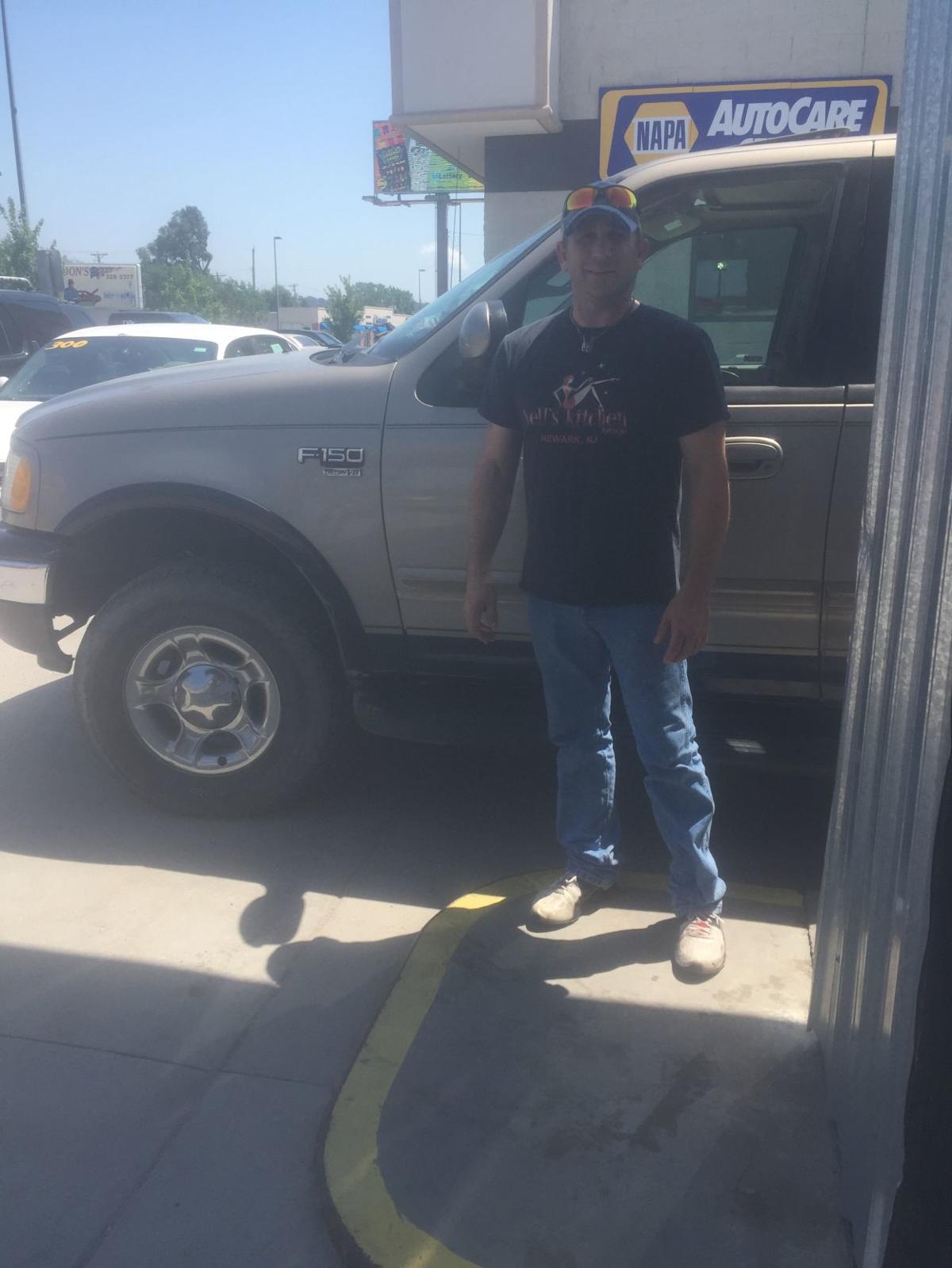 Driver stops runaway car but gets his pickup truck stolen