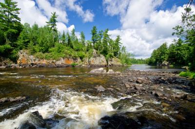 Pipestone Falls cascades down into Basswood Lake in the Boundary Waters Canoe Area Wilderness.