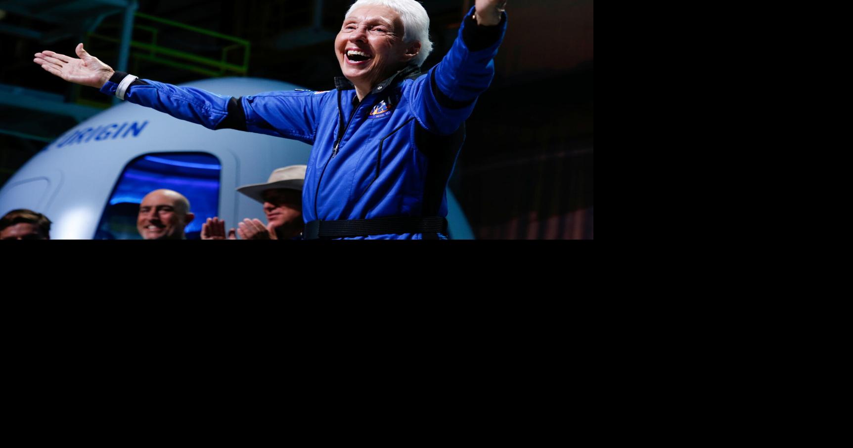 Wally Funk reacts after receiving her astronaut's wings from Blue Origin's Jeff Ashby, a former space shuttle commander at a post-launch press conference, in the nearby town of Van Horn