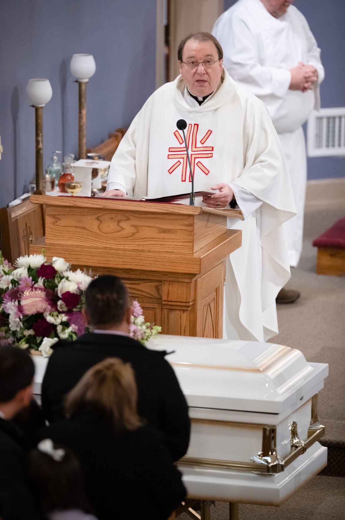 Grace Four white caskets line front of church at funeral for Schuyler family killed in crash