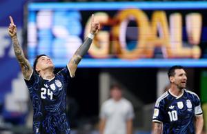 Argentina's Enzo Fernandez celebrates scoring their first goal with Lionel Messi.