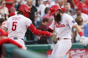 Phillies left fielder Brandon Marsh (16) celebrates with second baseman Bryson Stott (5) after hitting a home run against the Pittsburgh Pirates during the third inning at Citizens Bank Park on July 1, 2026.