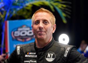 Greg Biffle talks to reporters during Daytona 500 media day at Daytona International Speedway on Feb. 16, 2022.