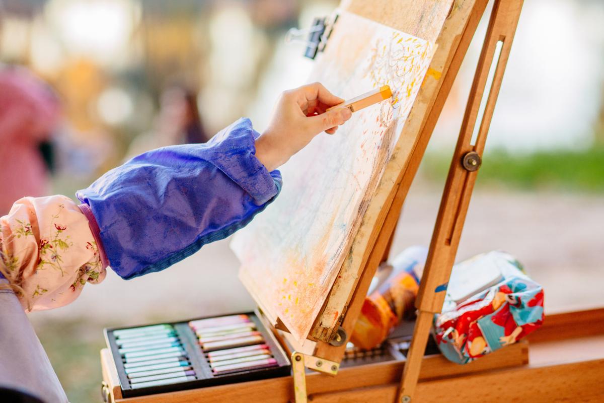 Little children during art lesson in summer camp