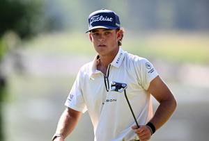 Jackson Koivun walks off of the 15th green after making a putt during the first round of the John Deere Classic golf tournament.