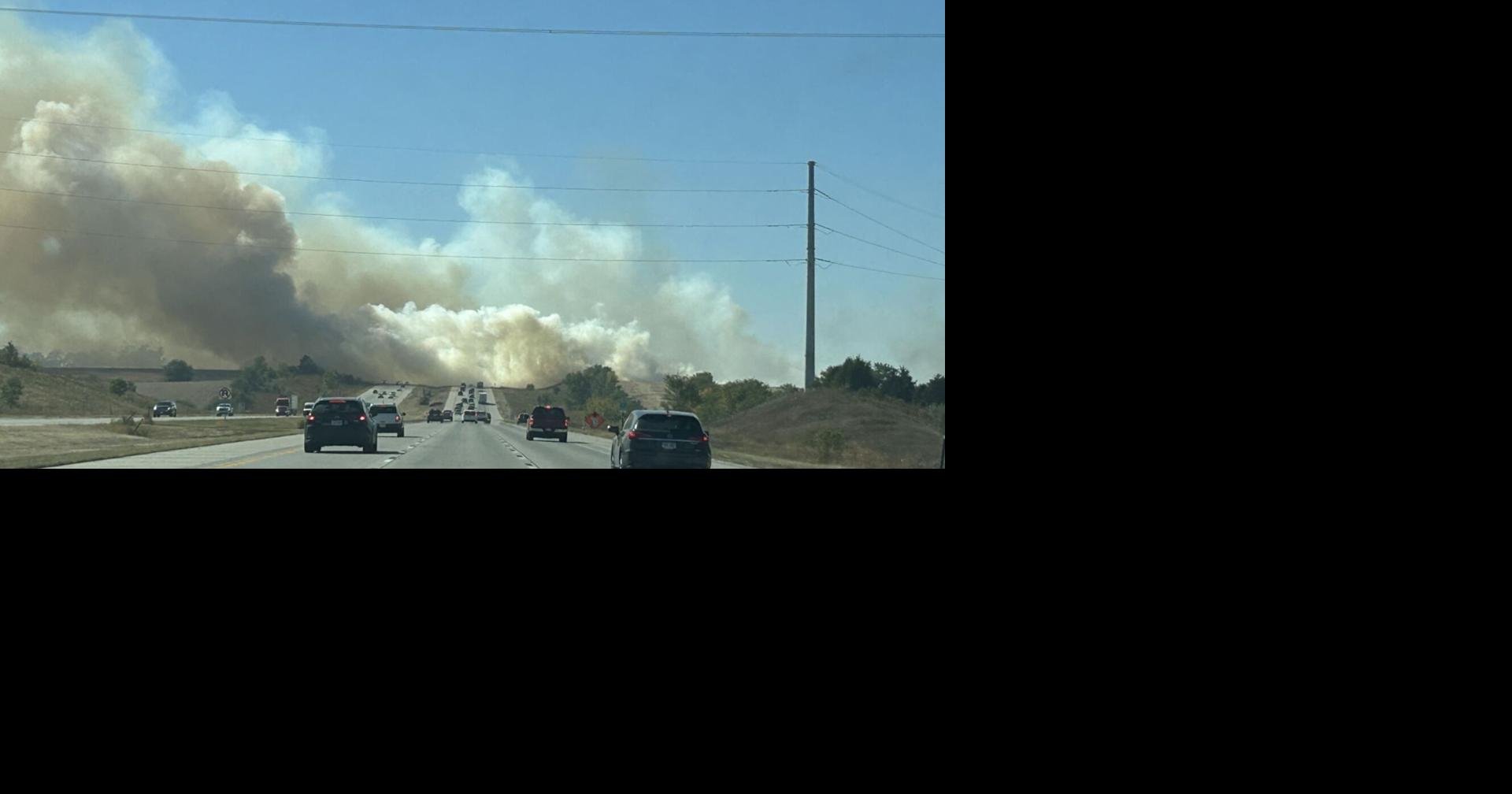 Firefighters battle a grass fire on Vala’s property in Gretna