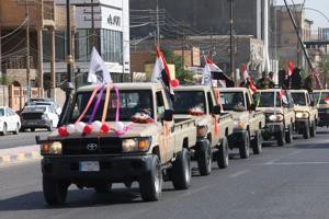 Celebrations after the withdrawal of US-led coalition forces from Iraq, in Najaf