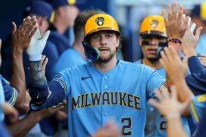Brewers second baseman Brice Turang celebrates with teammates after hitting a two-run home against the Marlins during the fifth inning April 18.