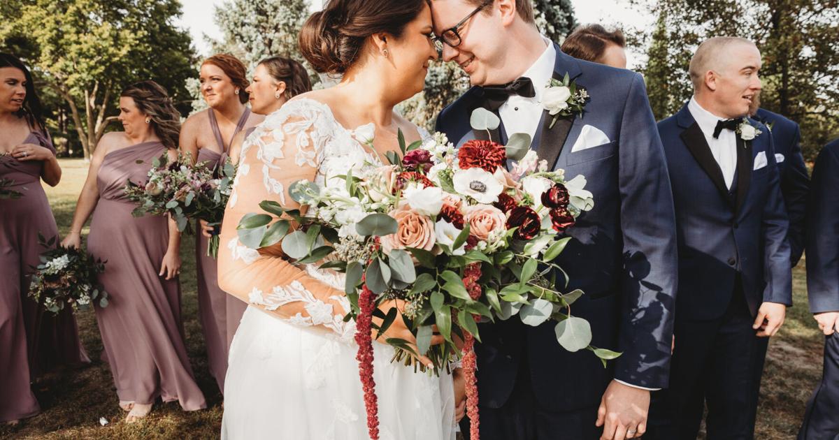 Omaha couple enjoys classic wedding with natural florals and a little Celine Dion music