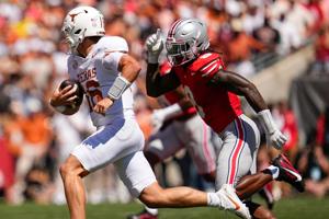 Ohio State Buckeyes linebacker Arvell Reese (8) pursues Texas Longhorns quarterback Arch Manning (16) during the NCAA football