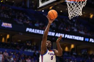 Mar 20, 2026; Tampa, FL, USA; Florida Gators center Rueben Chinyelu (9) shoots the ball in the second half against the Prairie View A&M Panthers during a first round game of the men's 2026 NCAA Tournament at Benchmark International Arena. Mandatory C