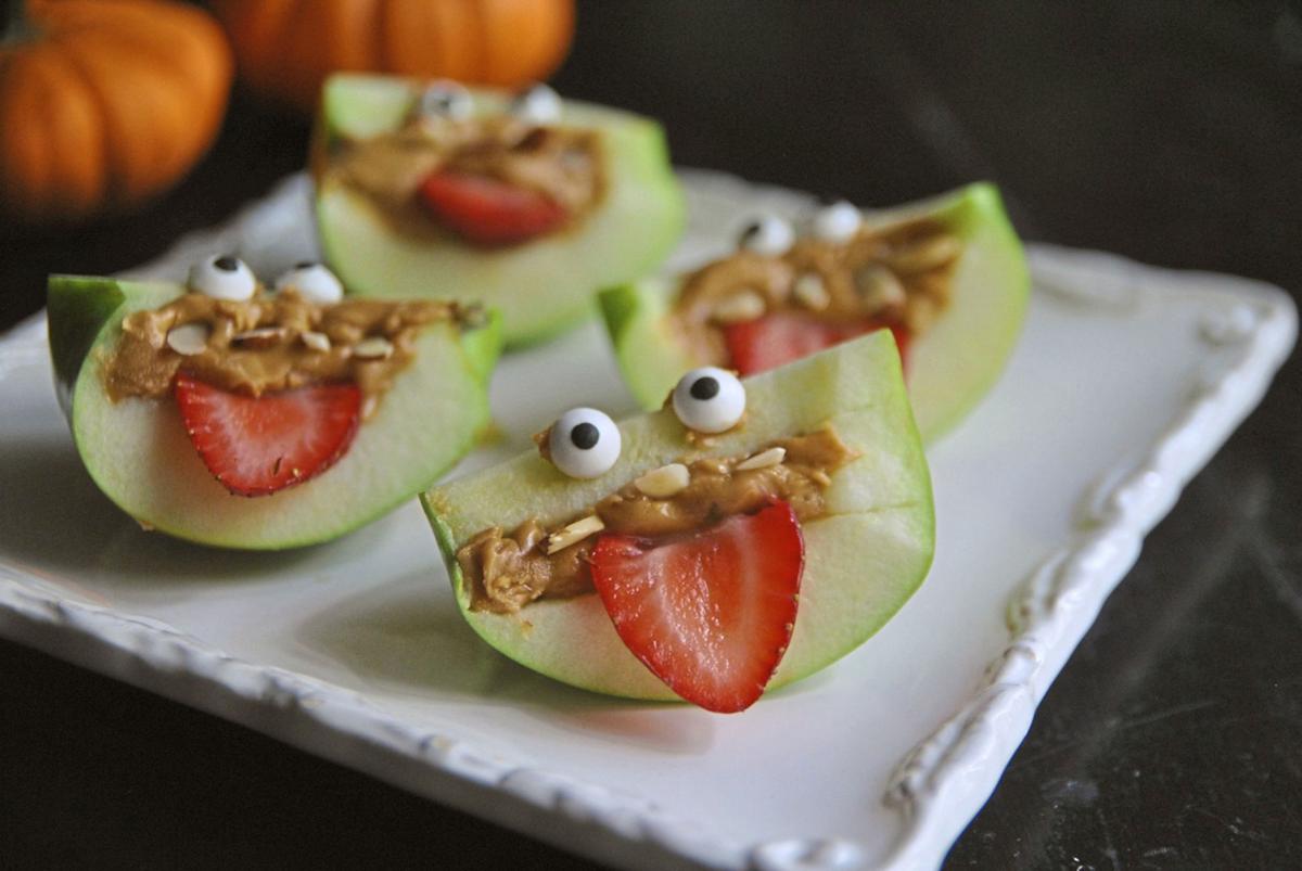 Turn apple wedges into spooky, silly and healthful apple monsters with almond teeth and sliced strawberry eyes.