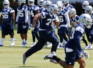 May 27, 2015; Dallas, TX, USA; Dallas Cowboys defensive end Greg Hardy (76) runs during OTAs at Dallas Cowboys Headquarters. Mandatory Credit: Matthew Emmons-USA TODAY Sports
