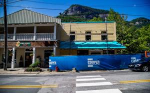 After witnessing catastrophic damage after Tropical Storm Helene on Sept. 27, 2024, Peter O'Leary, Mayor of Chimney Rock and owner of Bubba O'Leary's seen here on July 30, 2026, hopes to be fully reopened by Christmas 2026. Josh Bell/Asheville Citize