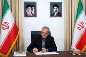 Iranian President Masoud Pezeshkian signs the document of U.S. Memorandum of Understanding in Tehran