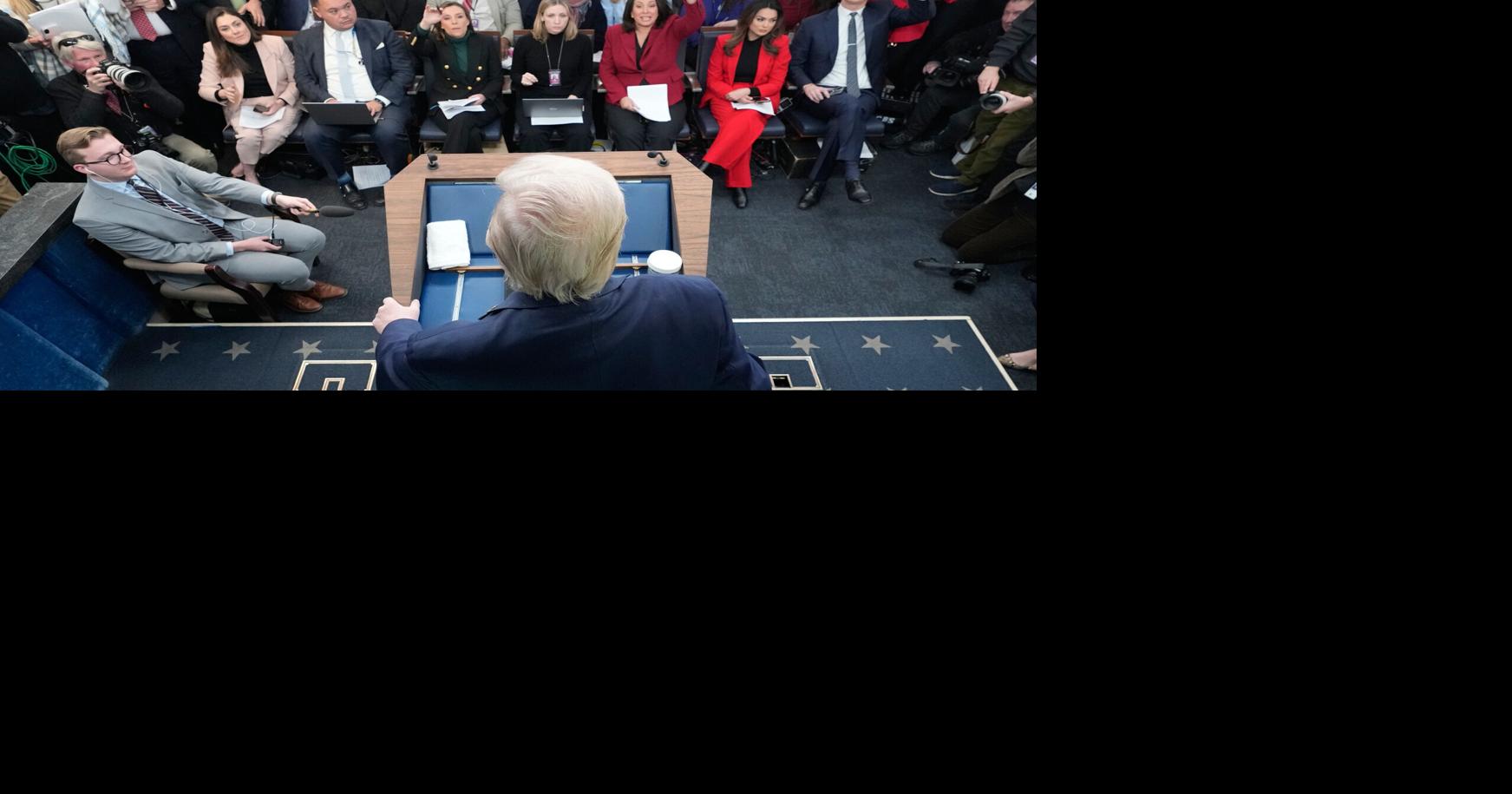 Trump recaps his first year back in office with winding remarks, paper tossing and impressions