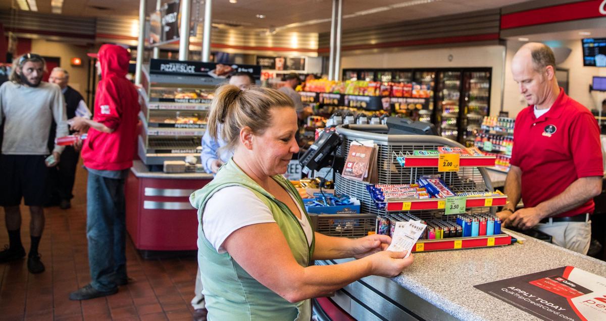 Ticket buyers dream big as Powerball jackpot tops $700 ...