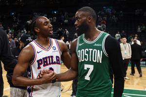 Philadelphia 76ers guard Tyrese Maxey (0) talks with Boston Celtics guard Jaylen Brown (7)after Philadelphia's win in game seven of the first round of the 2026 NBA Playoffs at TD Garden in Boston, Massachusetts, on May 2, 2026.