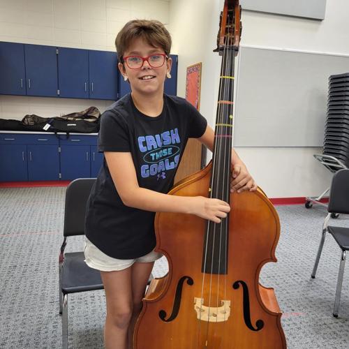 Strings attached District fourthgraders try out orchestra instruments