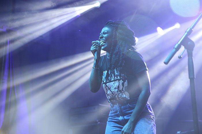 Sammus smiles onstage