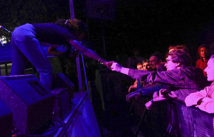 Sammus reaches to a fan