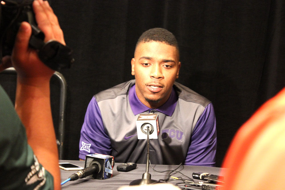 Quarterback Trevone Boykin #2 of the TCU Horned Frogs looks for an open  receiver against the Oklahoma Soon…