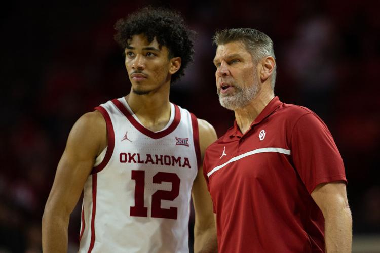 Milos Uzan and Porter Moser