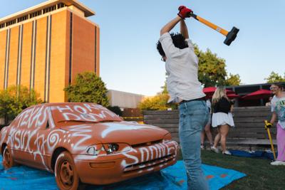 OU student swinging hammer