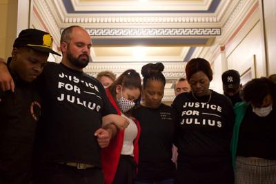 Julius Jones supporters praying in Capitol